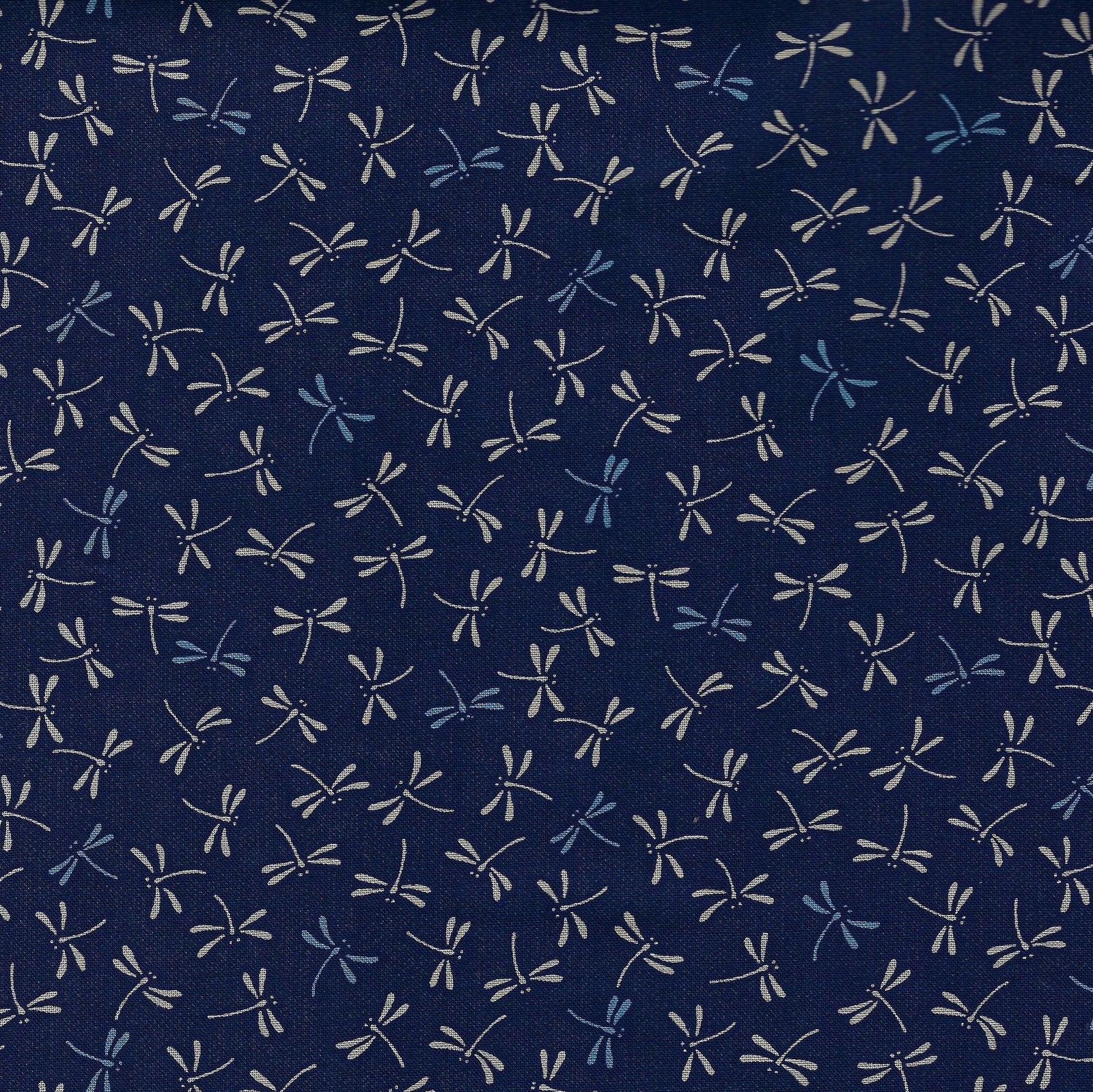 Traditional Japanese dragonfly design in white and light blue on an indigo background