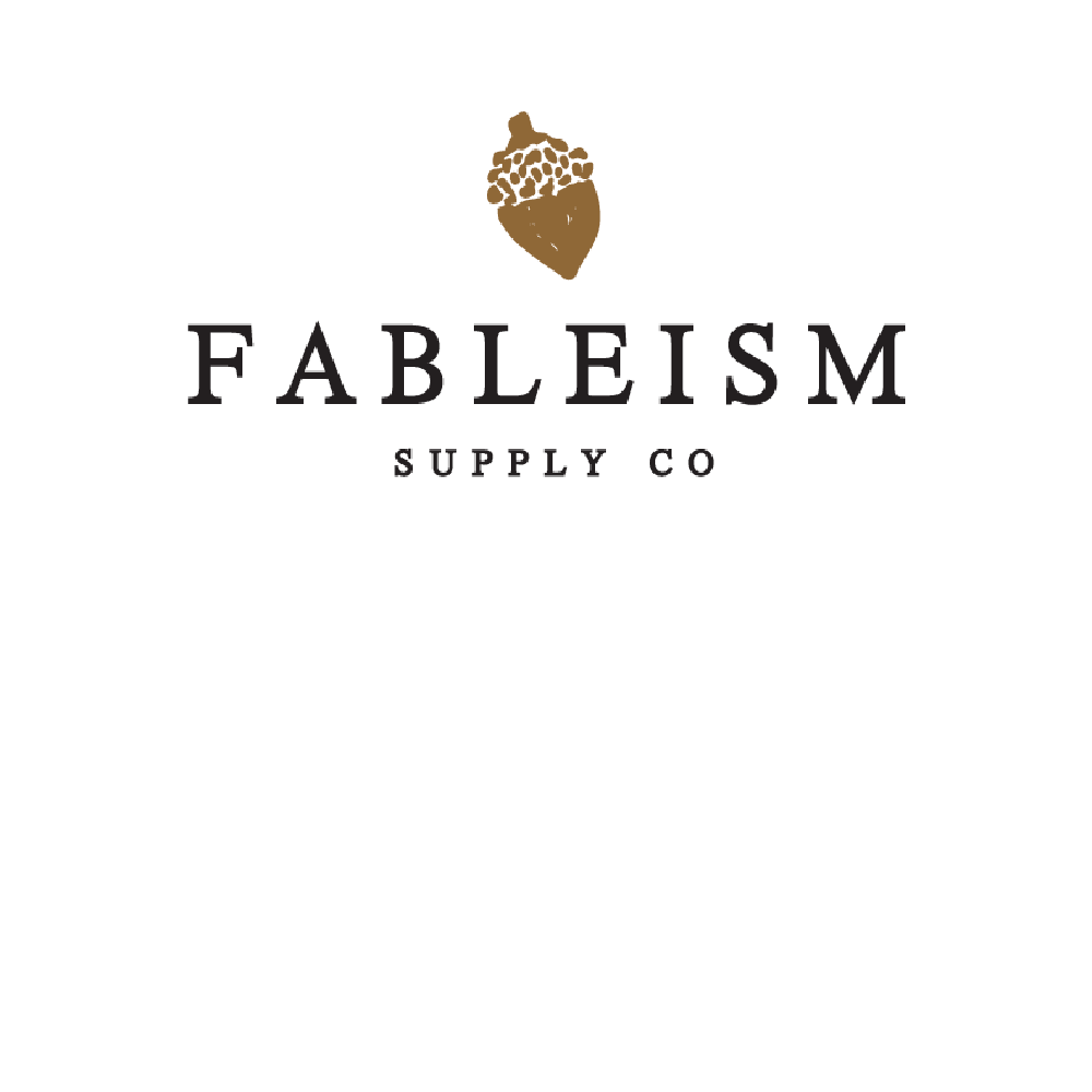 Fablesism Supply Company written under brown acorn logo